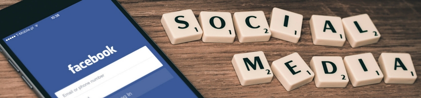 social media in scrabble letters and Facebook App